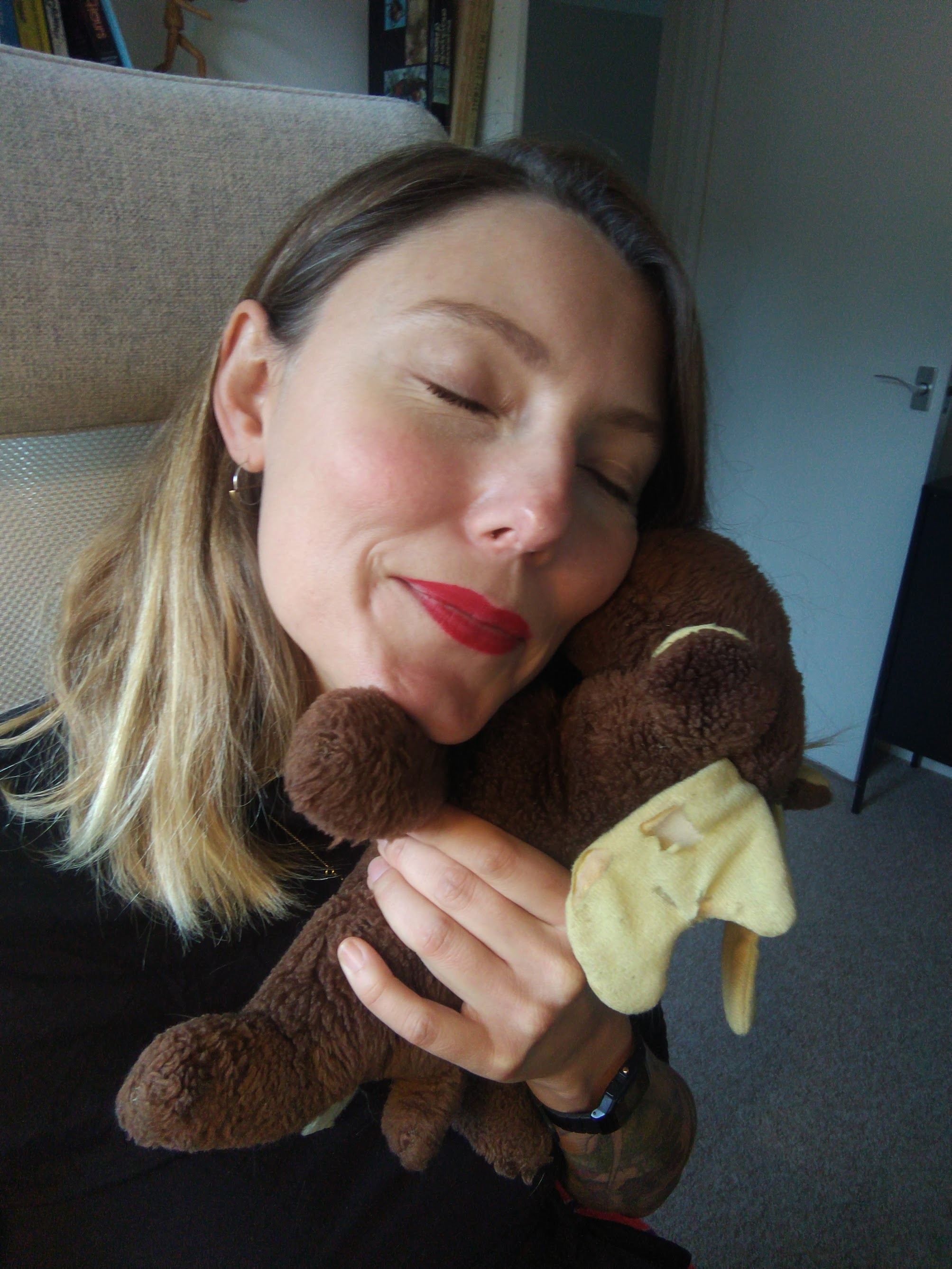 Sam Beckbessinger cuddling a stuffed moose