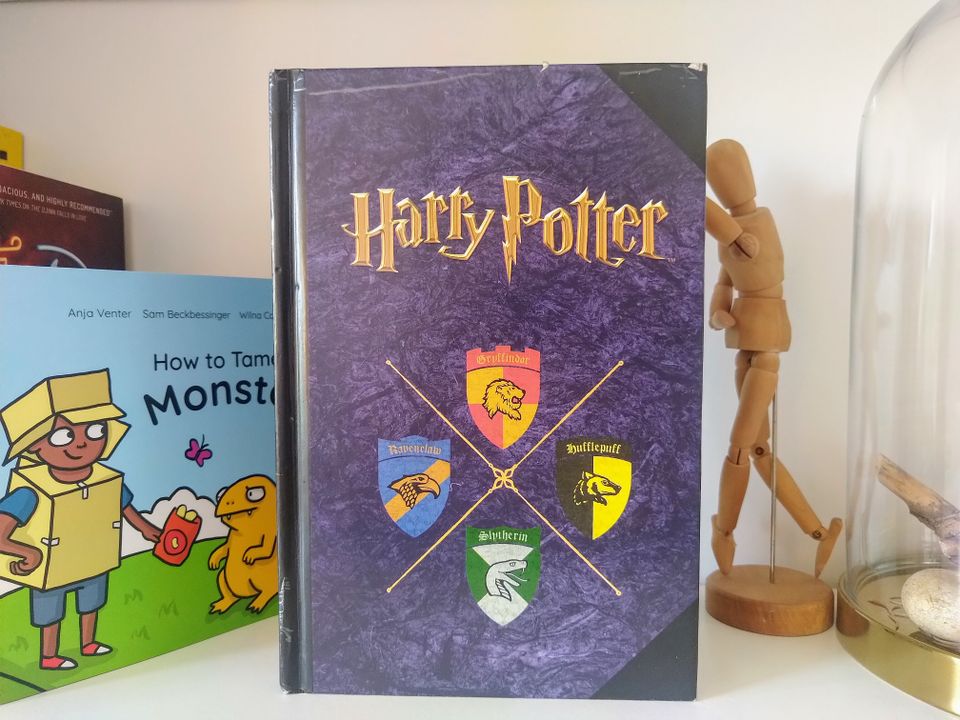 A photograph of a purple Harry Potter-themed notebook